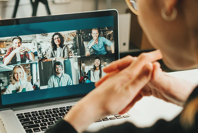 Video remote interpreter signing on laptop in Austin, TX